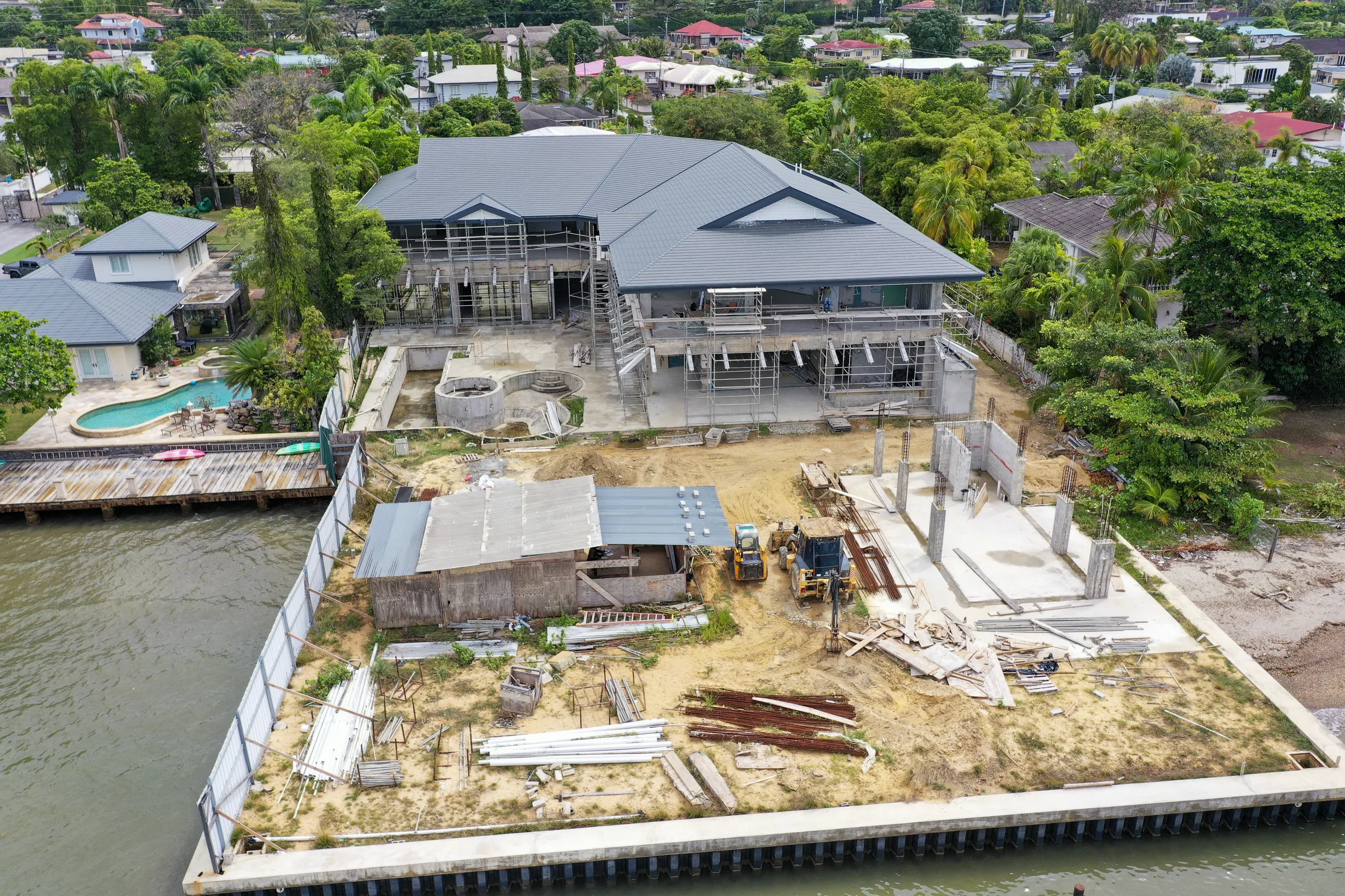 Aerial view of a waterfront residence under construction